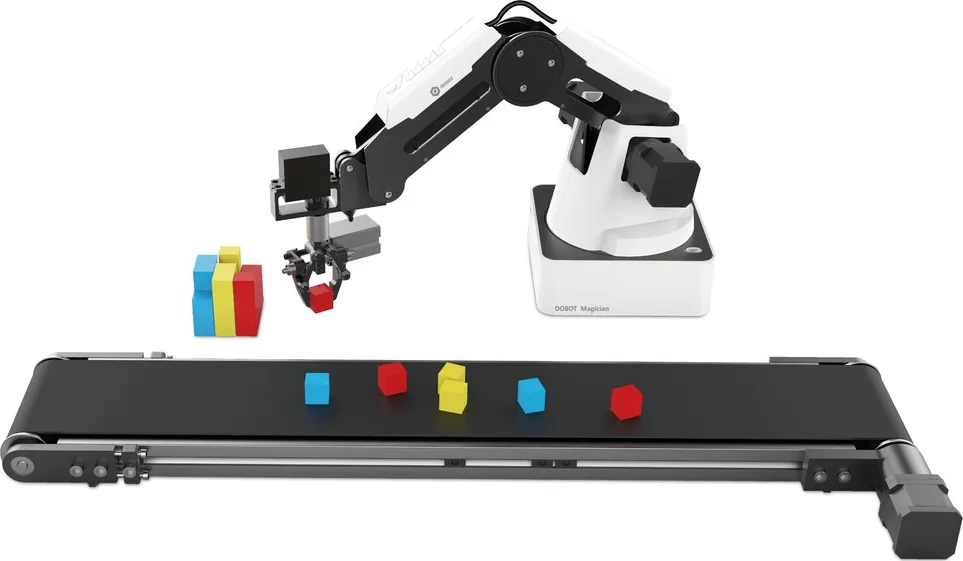 A DOBOT Magician arm above a conveyor carrying coloured blocks